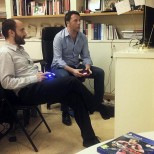 Matteo Renzi con Matteo Orfini mentre giocano alla play station (Ansa)